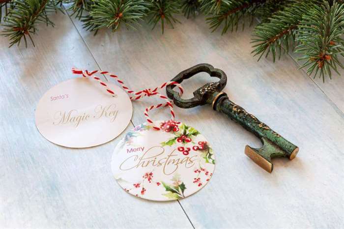 Christmas decoration - Santa's Magic Key. Close-up on light blue wooden background