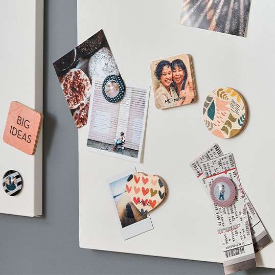 Magnets in different shapes and sizes with different pictures and quotes