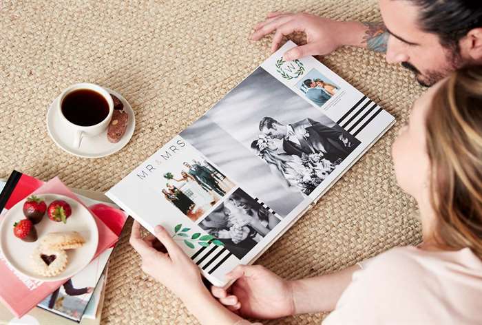 couple looking at their wedding photo book