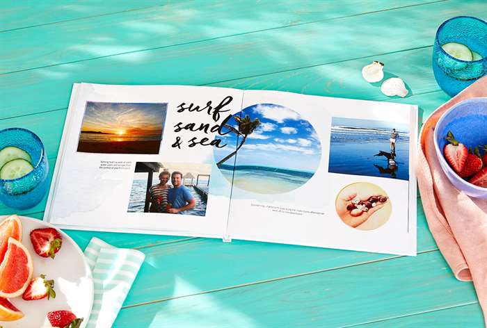 a travel and vacation photo book sits on table