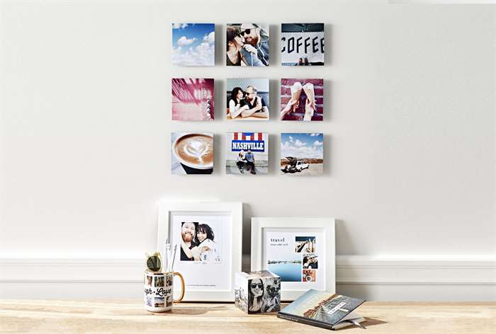 Square photo prints on wall.