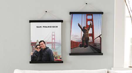 Hanging canvas prints of san francisco golden gate bridge on a gray wall 