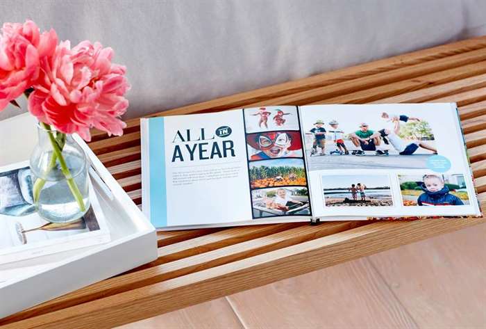 layflat custom designed photo book sits on a bench