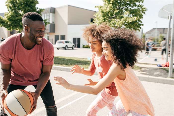 Father playing basketball with kids and more family activities