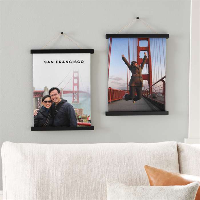 Two hanging canvas prints as wall decor above a couch featuring photos of San Francisco