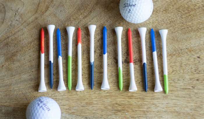 White golf tees dipped in colorful paint