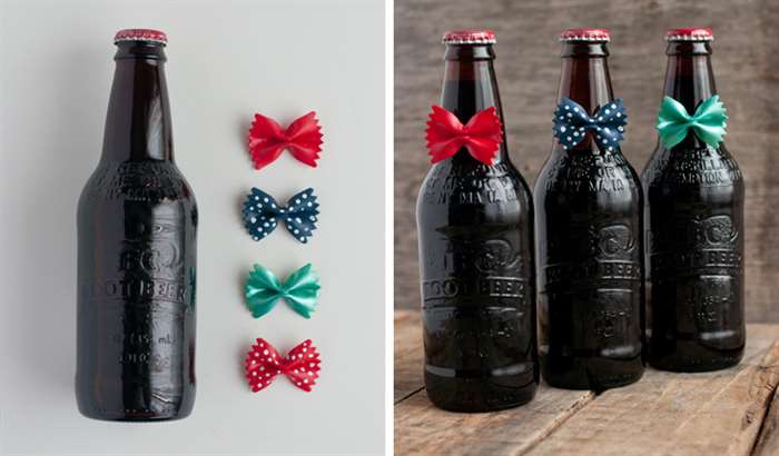 Painted bowtie pasta attached on root beer bottles