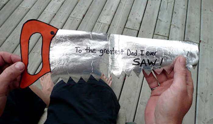 Foil card shaped like a saw with message for dad