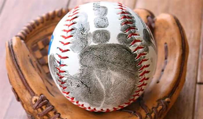 Baseball with baby handprint