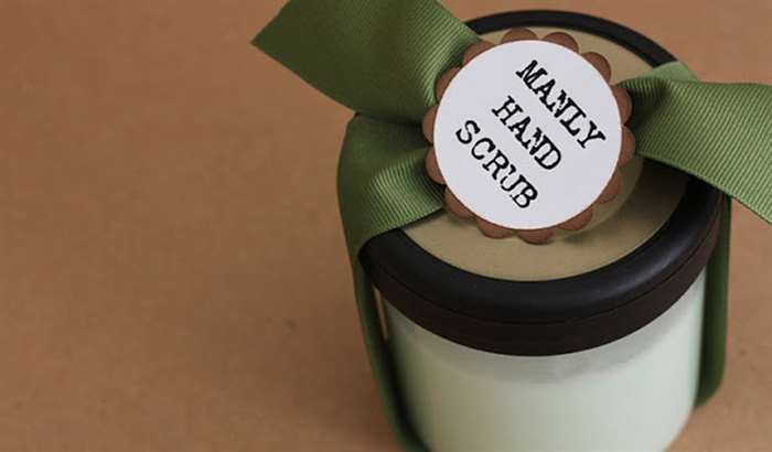 Hand scrub in a jar wrapped in green ribbon