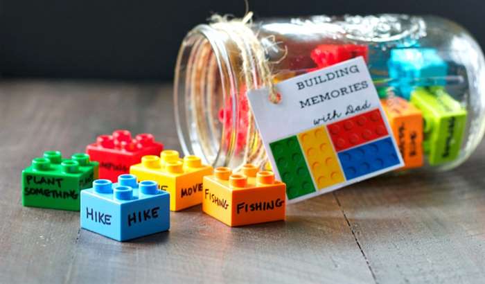 Building blocks in a jar with activities written on them