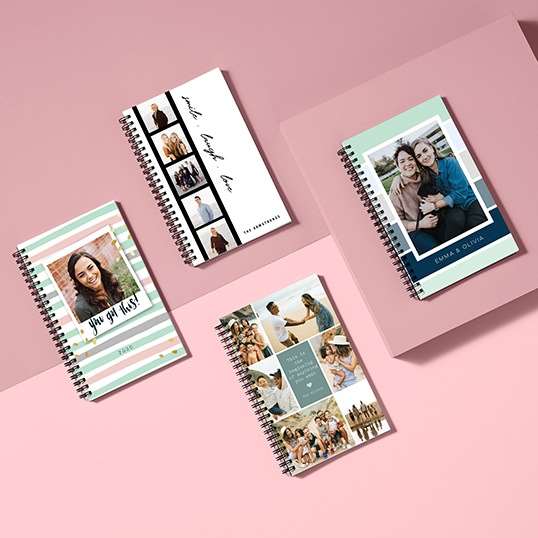 Custom notebooks designed with photos for a baby shower gift