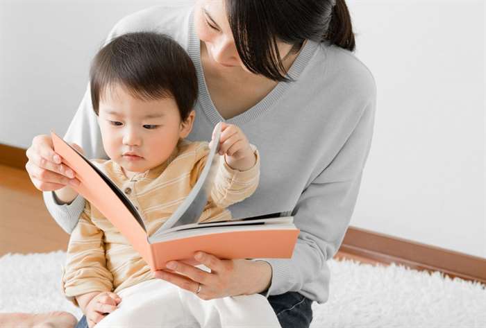 mother and baby reading