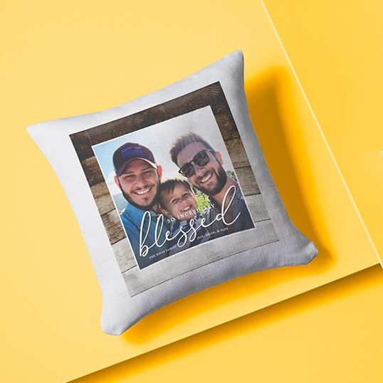 Custom pillow with a photo of a young kid and two dads