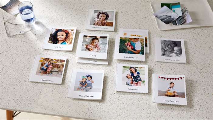 small photo books laying out on table