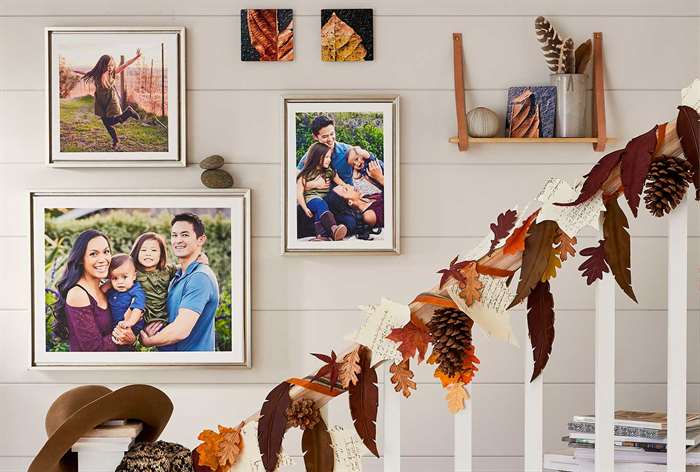 Framed pictures hanging in stairwell.