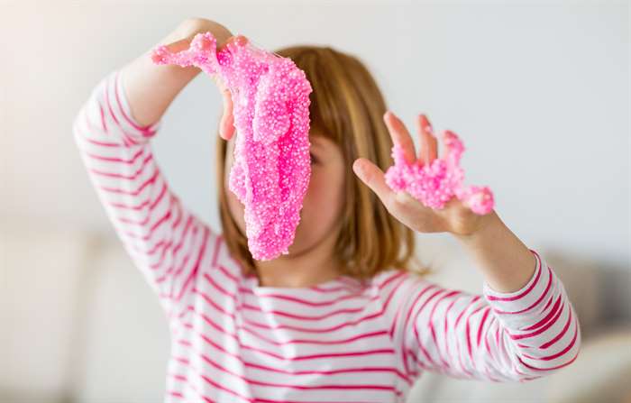 Little girl making homemade slime 