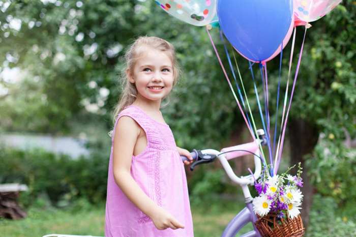 little girl with decorated bike