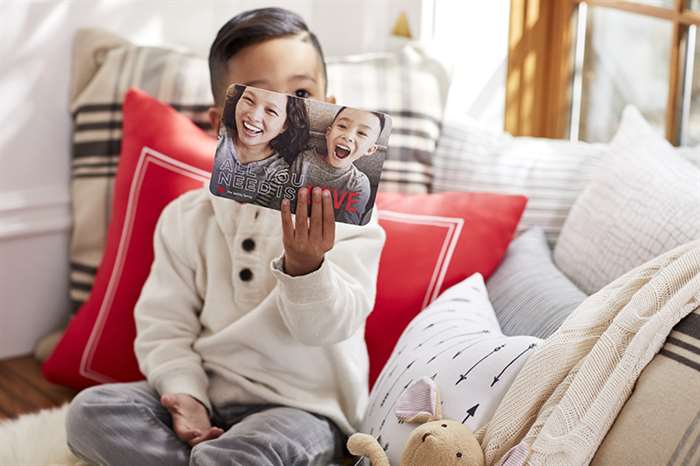 kid holding cute valentines card