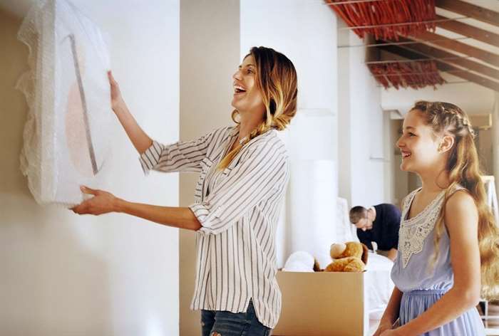 Woman hanging canvas print. 