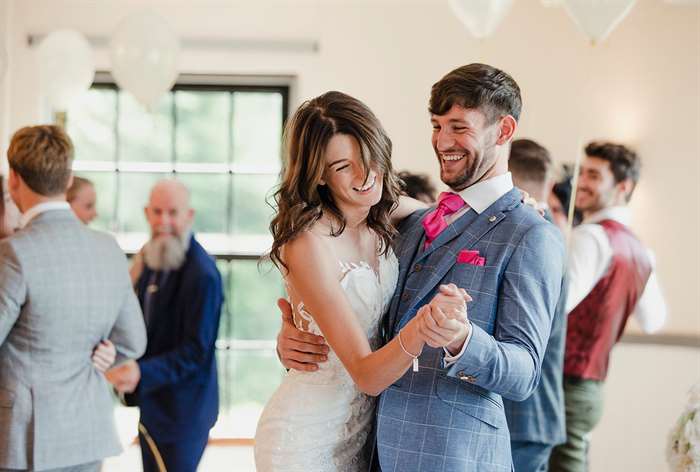 couple dancing at their wedding. 