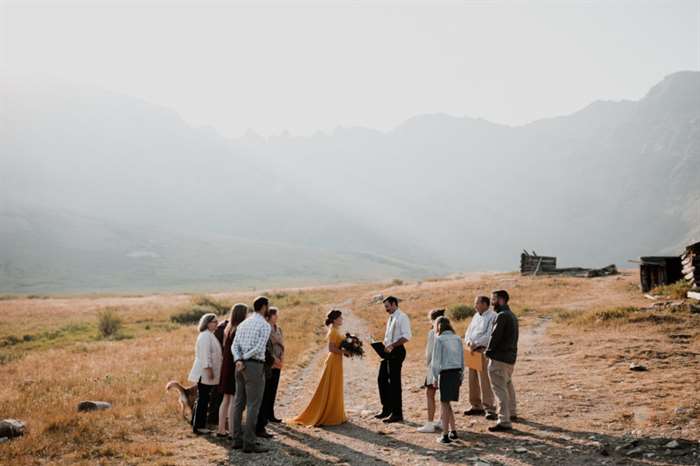 Socially distant wedding with only family outside in the outdoors