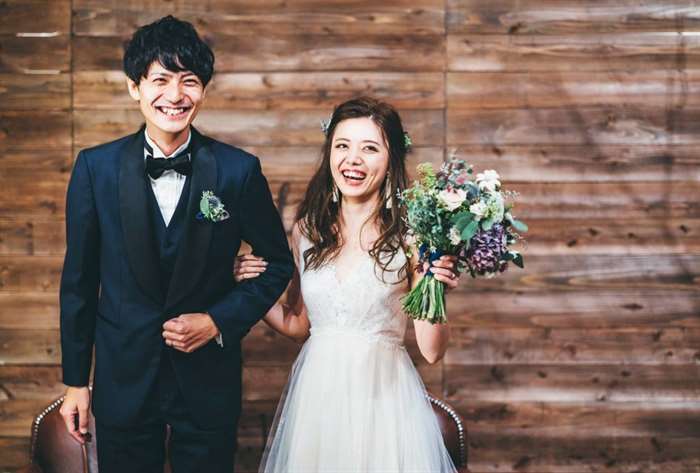 Married couple in black tie attire.