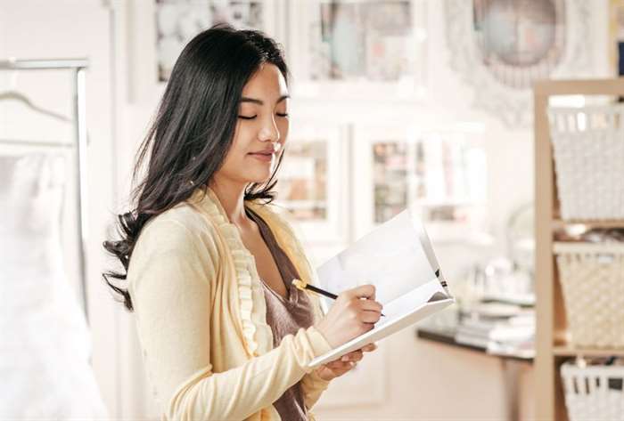 Woman writing in a notebook