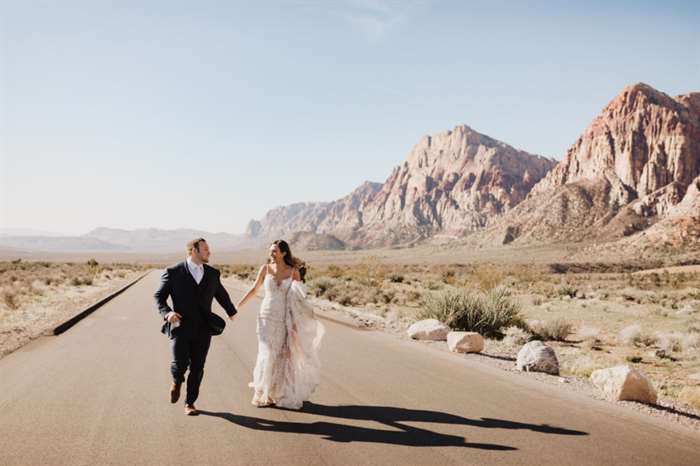 Couple in nature just married embracing their wedding day