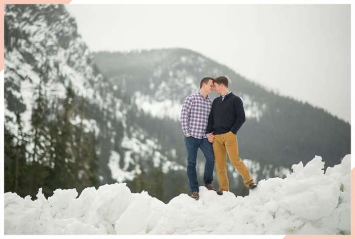 Couple embraces on a snowy mountain