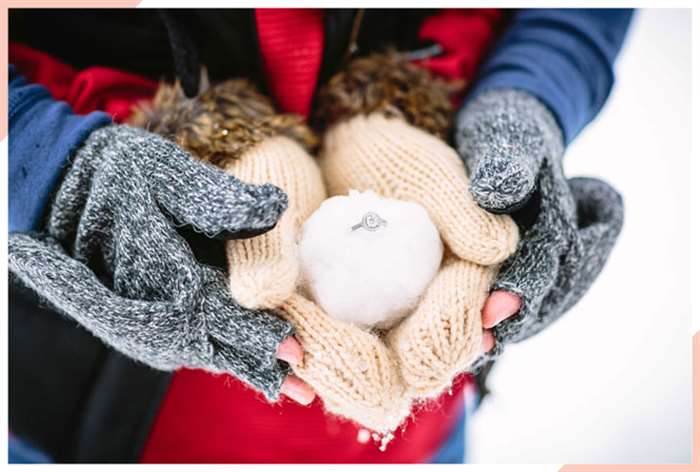 engagement ring in snow christmas engagement photo