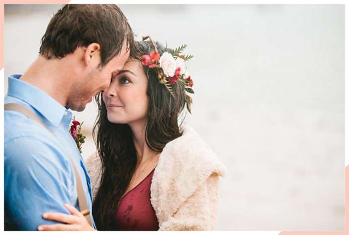 couple loving embrace wet hair christmas engagement photo