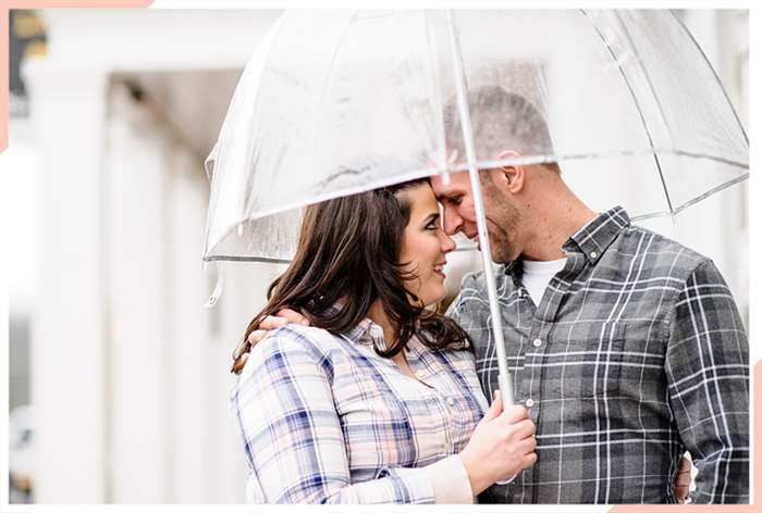 couple under umbrella christmas engagement photo