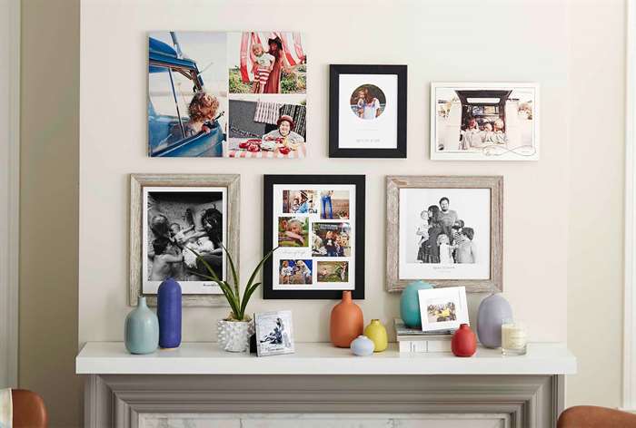 Variety of framed photos and canvas prints hanging in home