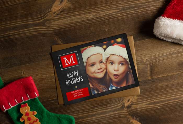 Sisters in Santa hats on Christmas card