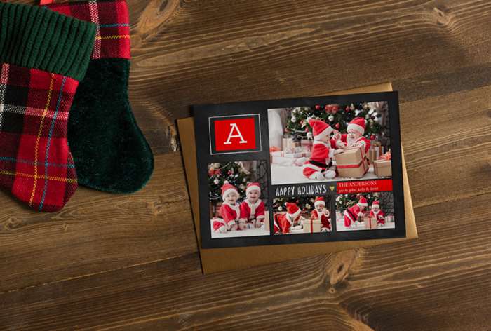 Babies in Santa costumes on card