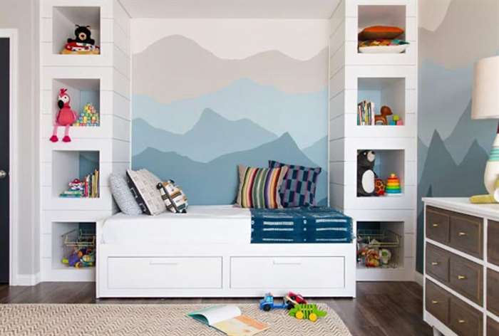 Bench with mountain wall mural in kids room.