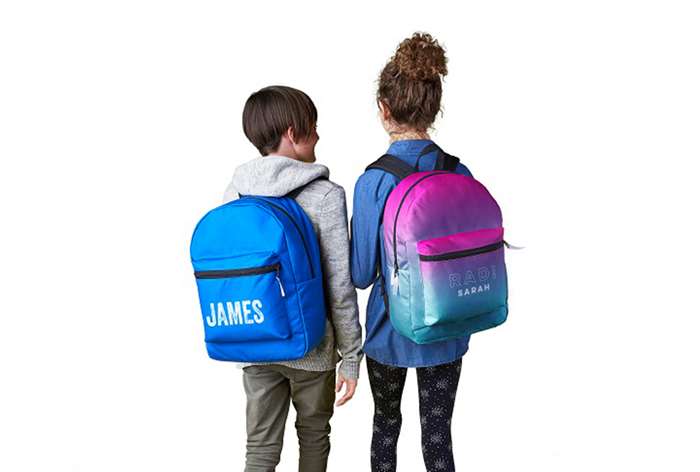 Boy and girl wearing backpacks.