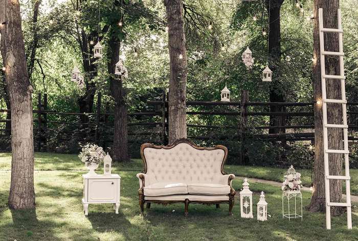 Vintage furniture on green lawn.