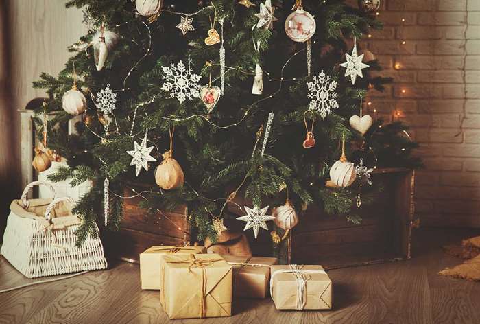 Christmas tree with gold wrapped presents.