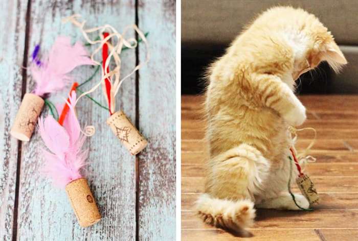 cat playing with a feather toy made from wine corks