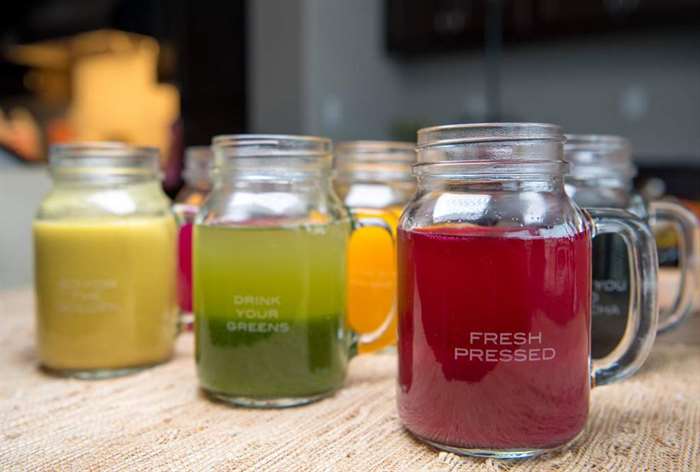 mason jars with colorful fresh pressed juice