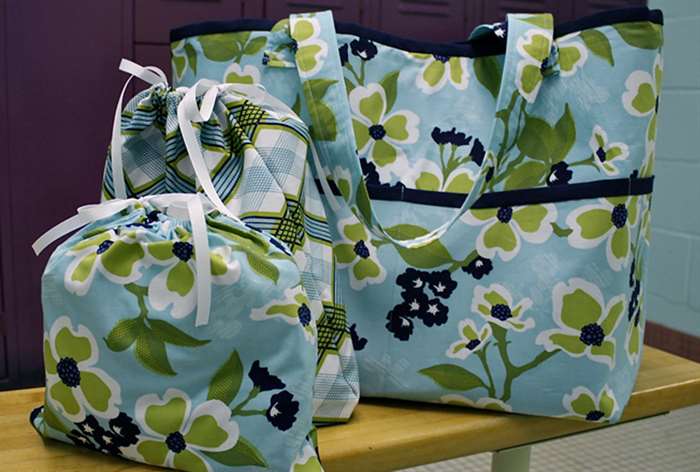 set of three blue bags with green flowers