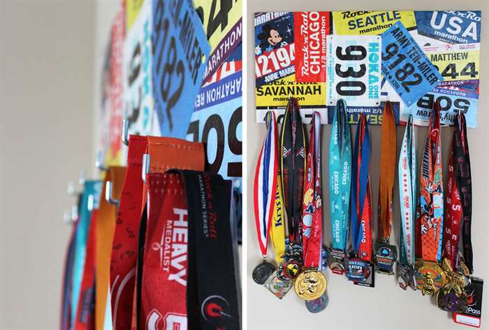 race medals hanging below race bibs