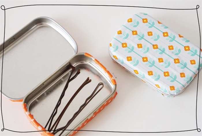 Mint tin decorated with washi tape and filled with bobby pins