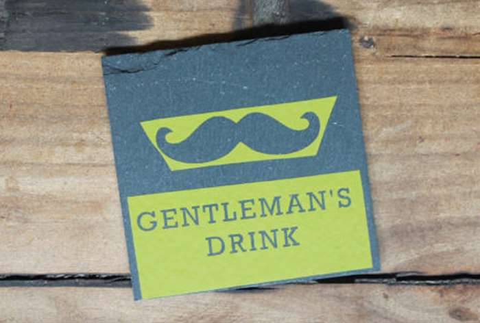 slate coaster that says gentleman's drink in lime green