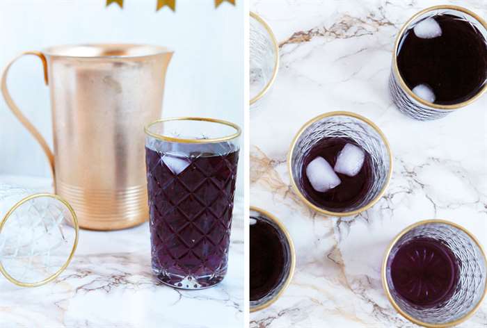 cocktail glasses with a gold rim on a marble table