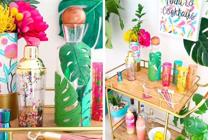 colorful bar cart with a decanter covered in a tropical leaf pattern