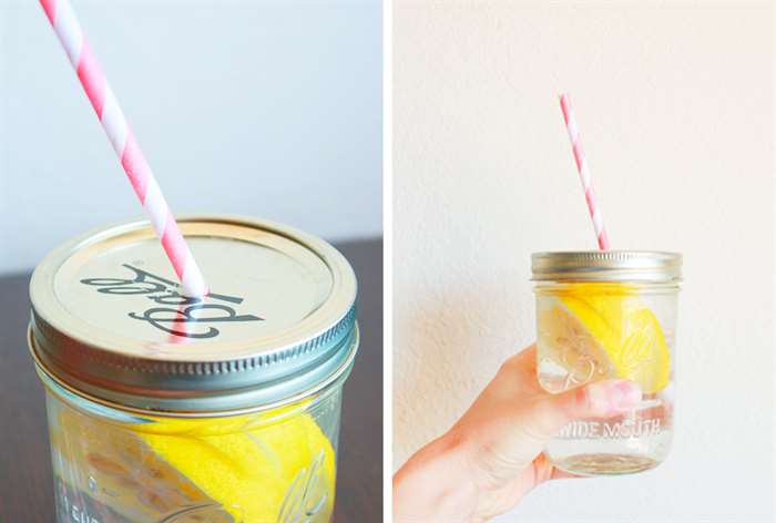 mason jar with striped straw filled with lemon water