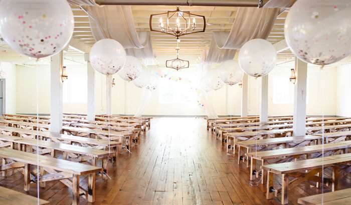 giant confetti filled balloon aisle